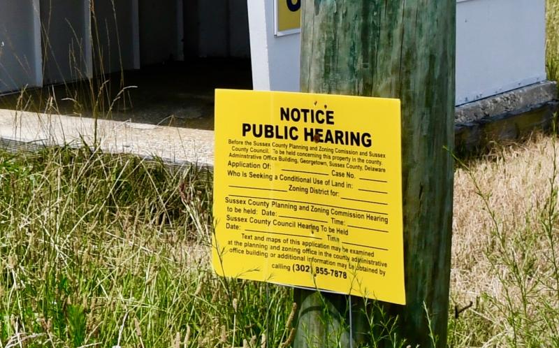As pointed out by a resident during a July 27 hearing, the notice sign posted on the parcel is not filled in with information pertaining to the time or date of the planning and zoning and county council public hearings.